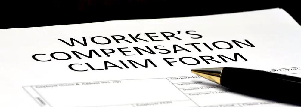 Image of a close up of workers’ compensation claims form on a desk.