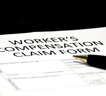 Image of a close up of workers’ compensation claims form on a desk.