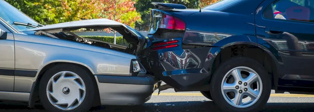 A rear end collision between two cars