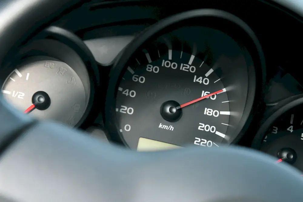 A speedometer showing the car going 160mph